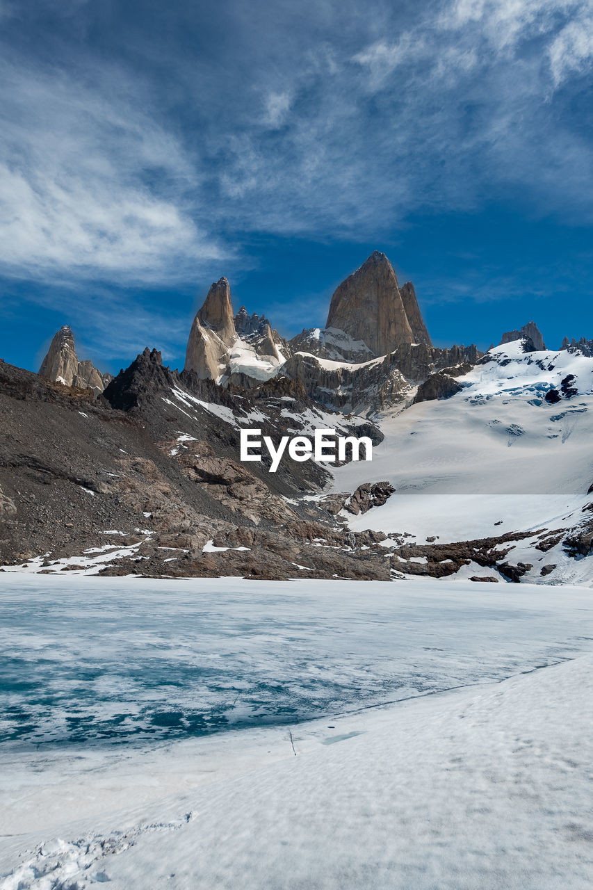 Scenic view of snowcapped mountains against sky