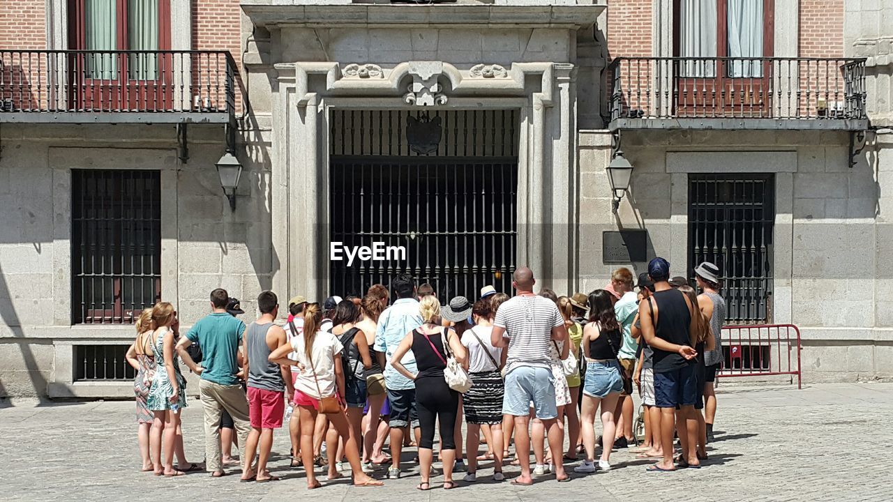 Men and women at plaza de la villa square