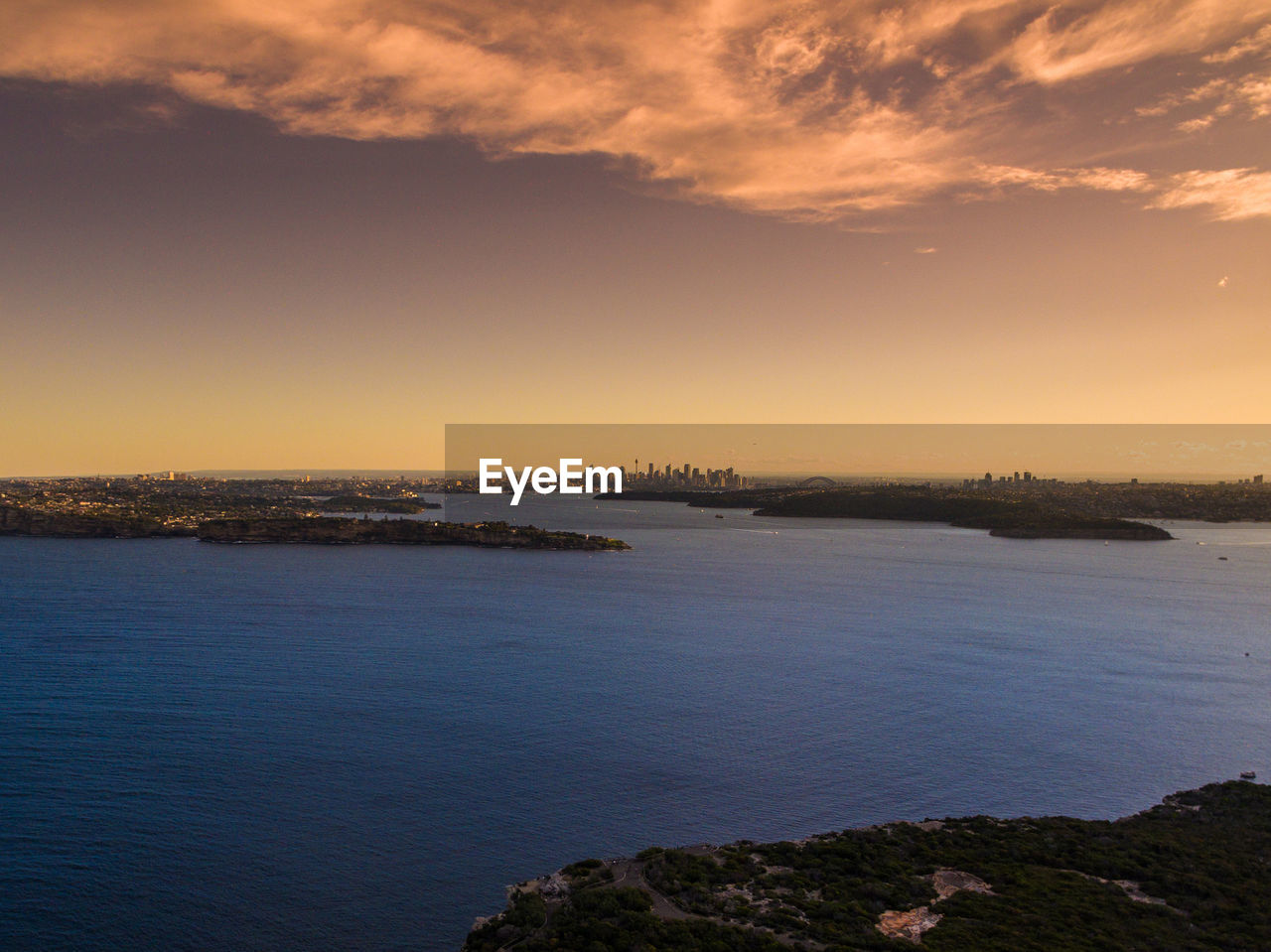 Scenic view of sea against sky at sunset