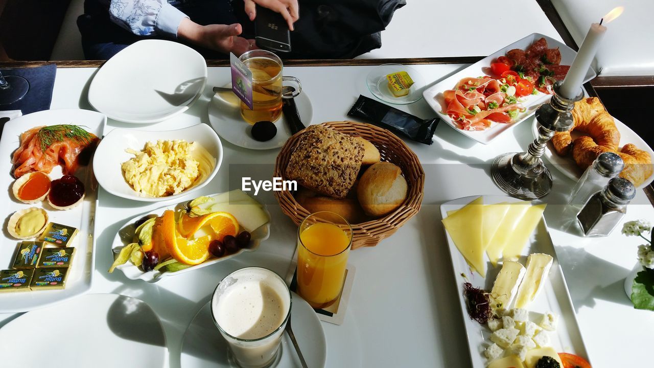 High angle view of various food on table for breakfast