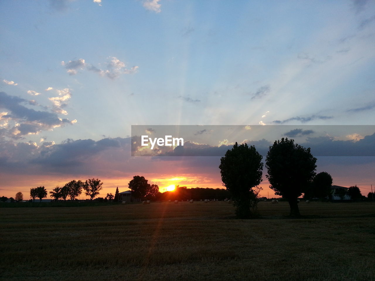 Scenic view of landscape against cloudy sky