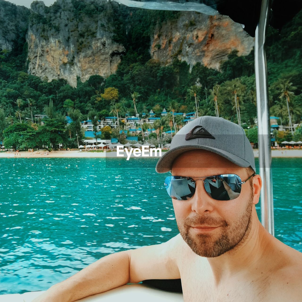 CLOSE-UP PORTRAIT OF MAN IN SWIMMING POOL