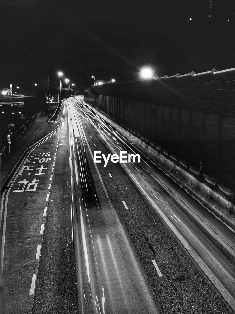 High angle view of light trails on highway at night