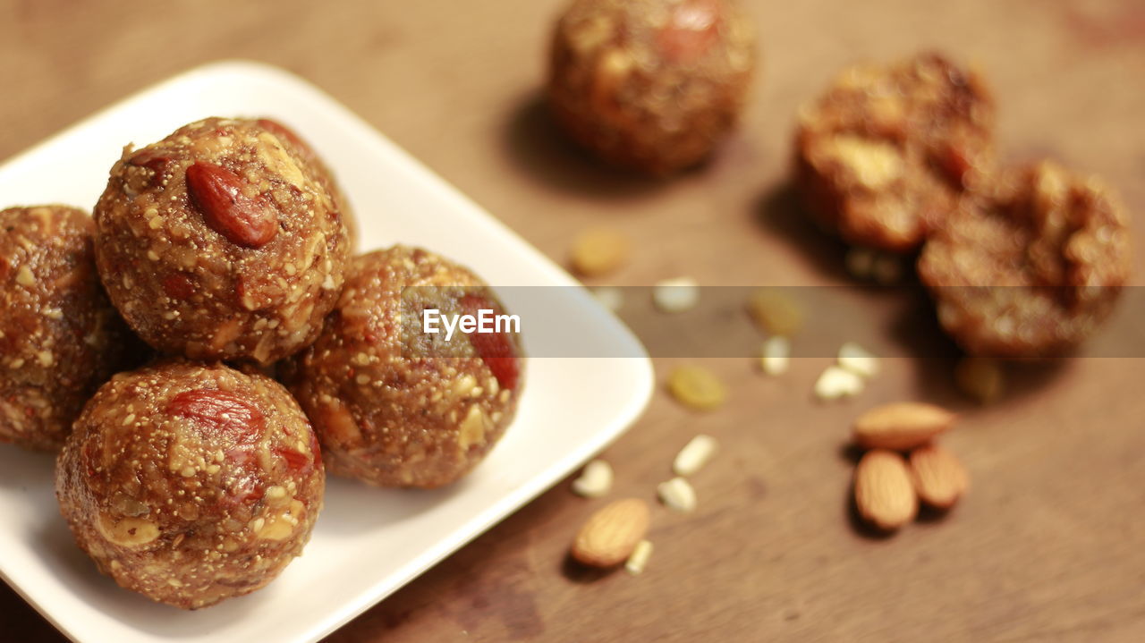 Close-up of dessert balls in plate on table