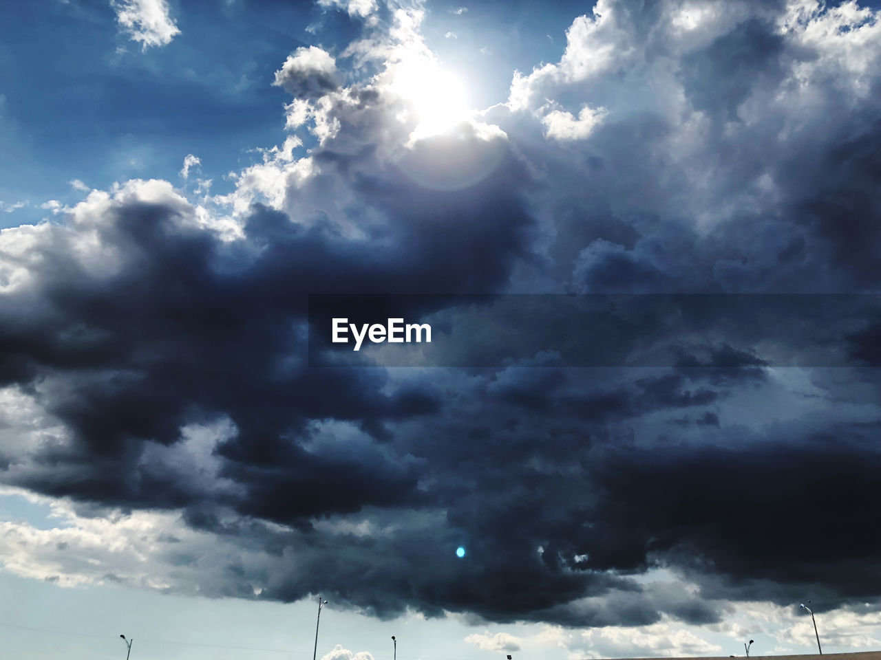 LOW ANGLE VIEW OF STORM CLOUDS OVER CLOUD