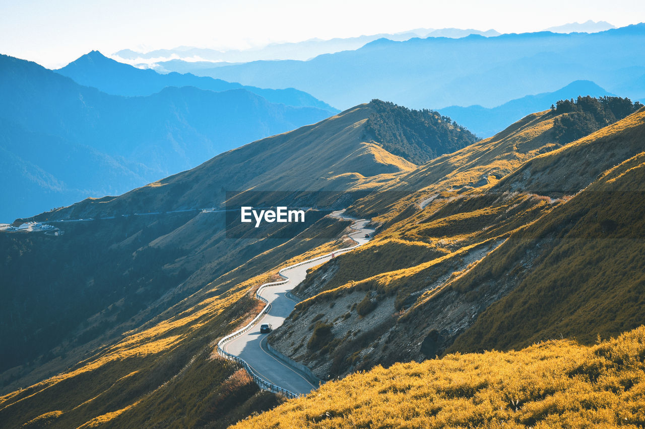 High angle view of snowcapped mountains against sky