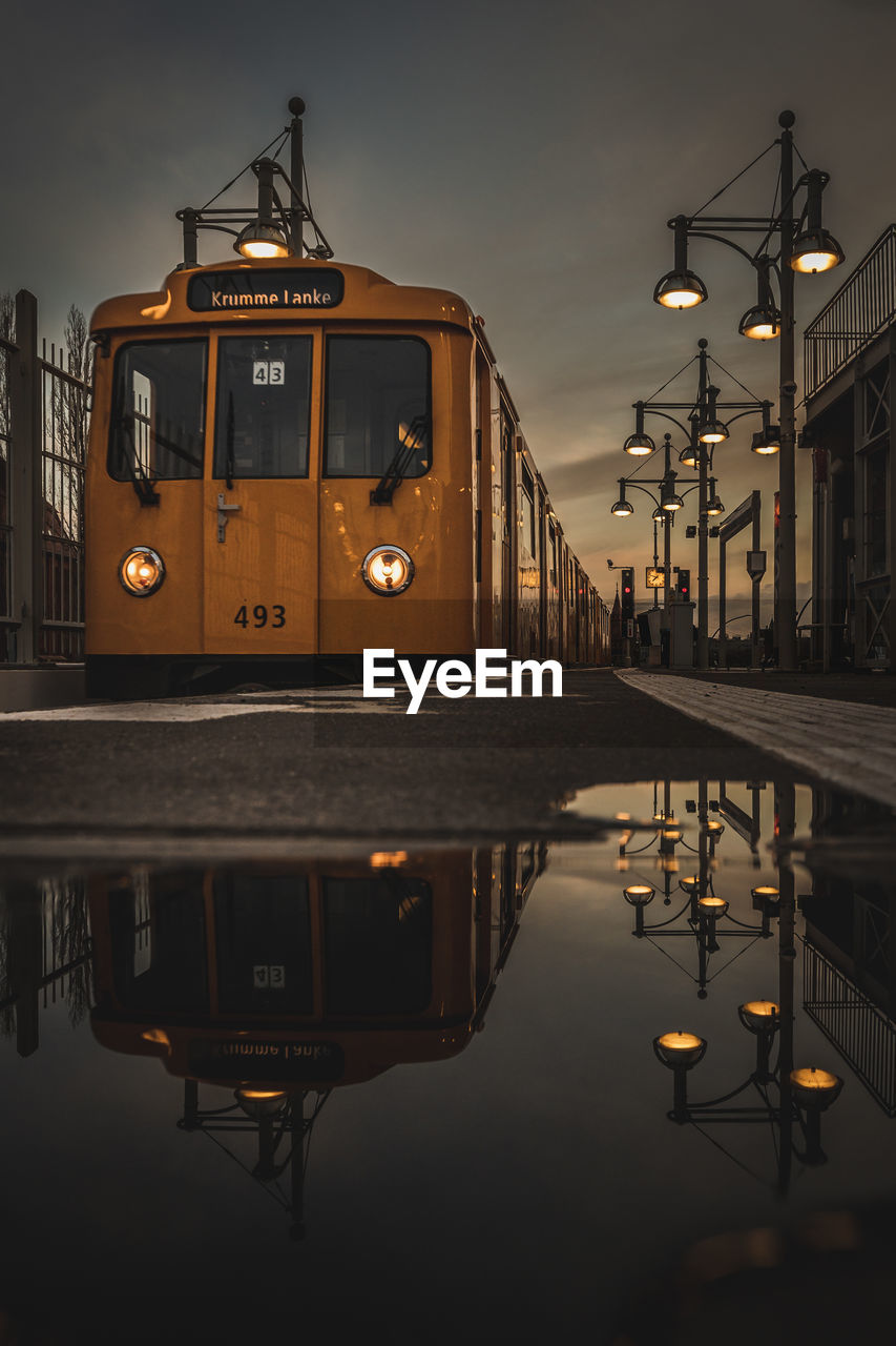 Reflection of the train and the station lamps after the rain