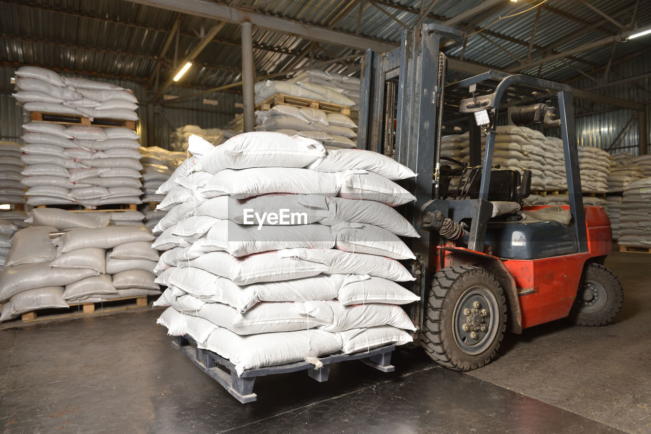 Forklift in a warehouse with wheat in sacks