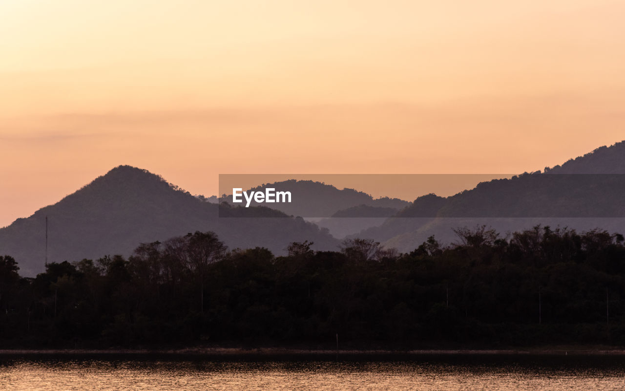 SCENIC VIEW OF MOUNTAINS AGAINST SKY DURING SUNSET