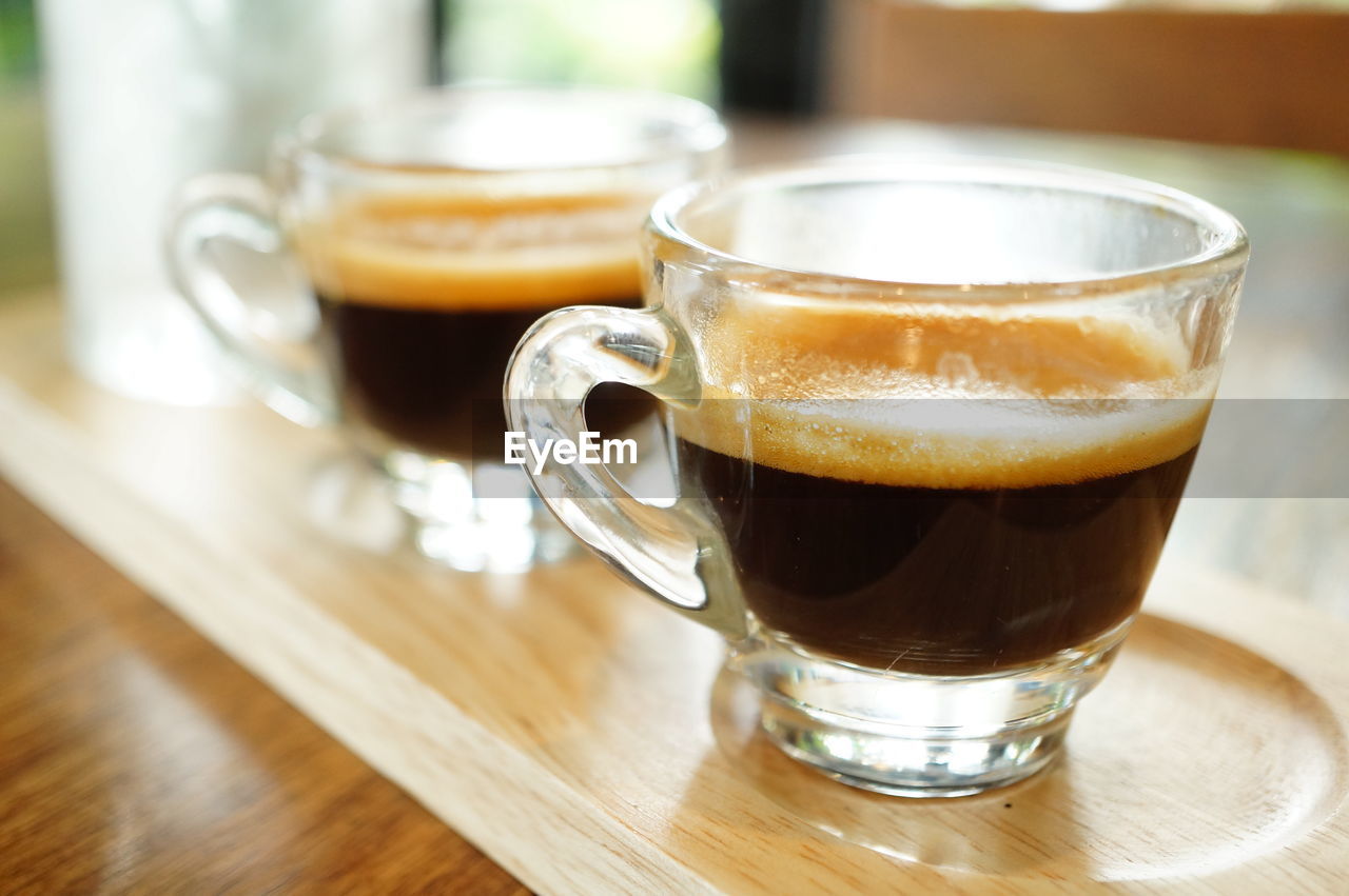 CLOSE-UP OF COFFEE ON TABLE IN CUP