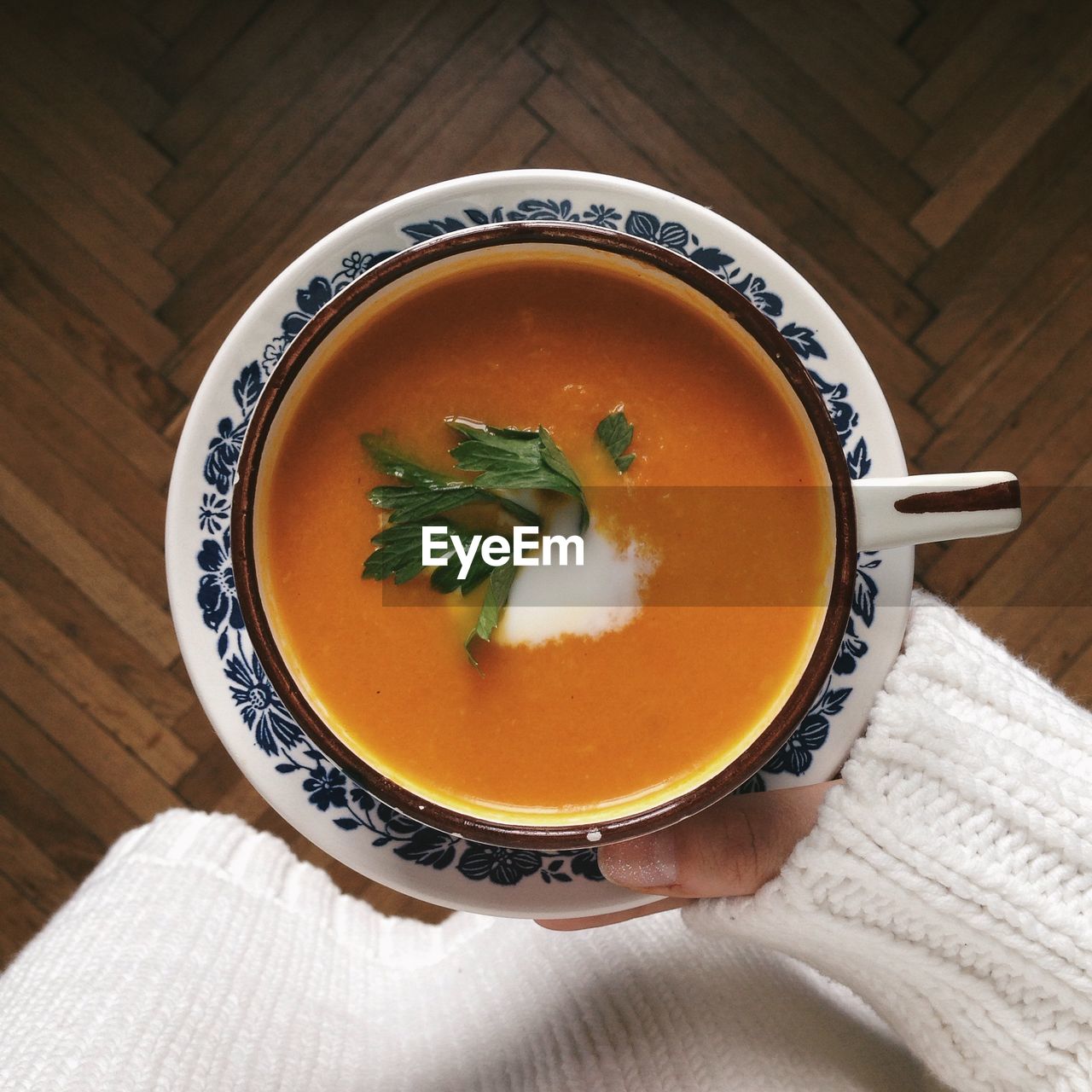 Midsection of woman holding soup