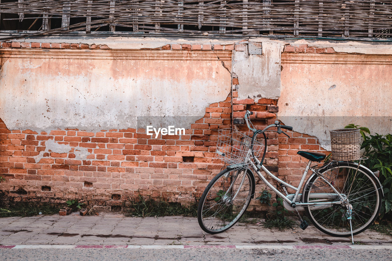 BICYCLE PARKED ON WALL