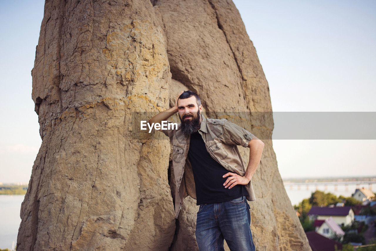 Portrait of a man near the mountain