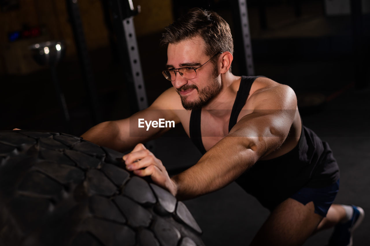 Young exercising at gym