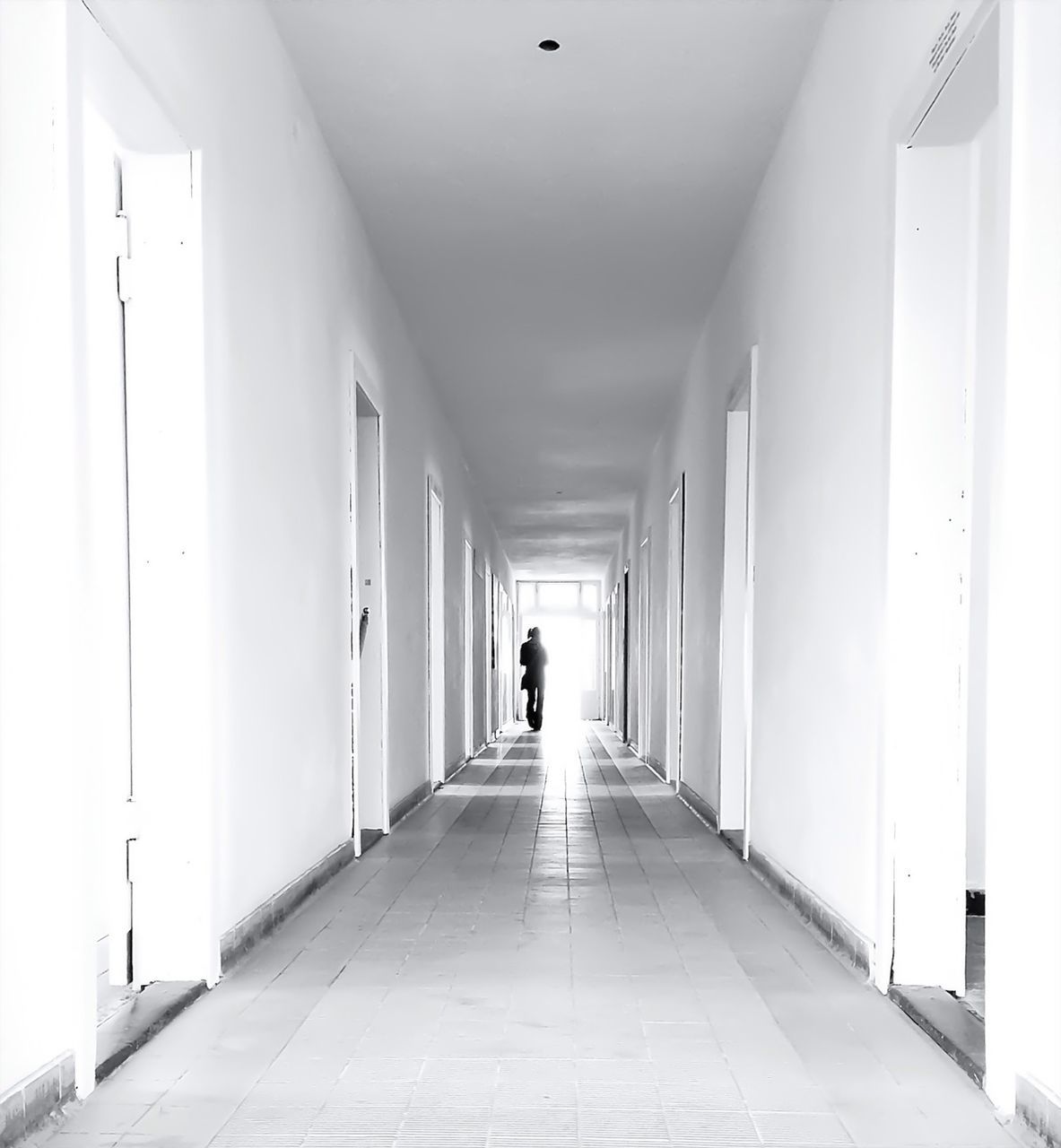 Silhouette of man in corridor