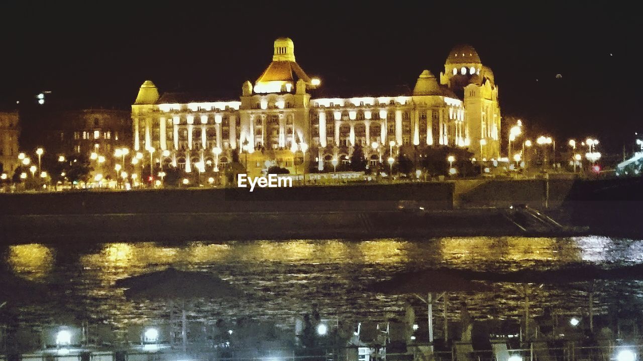 REFLECTION OF ILLUMINATED BUILDINGS IN WATER