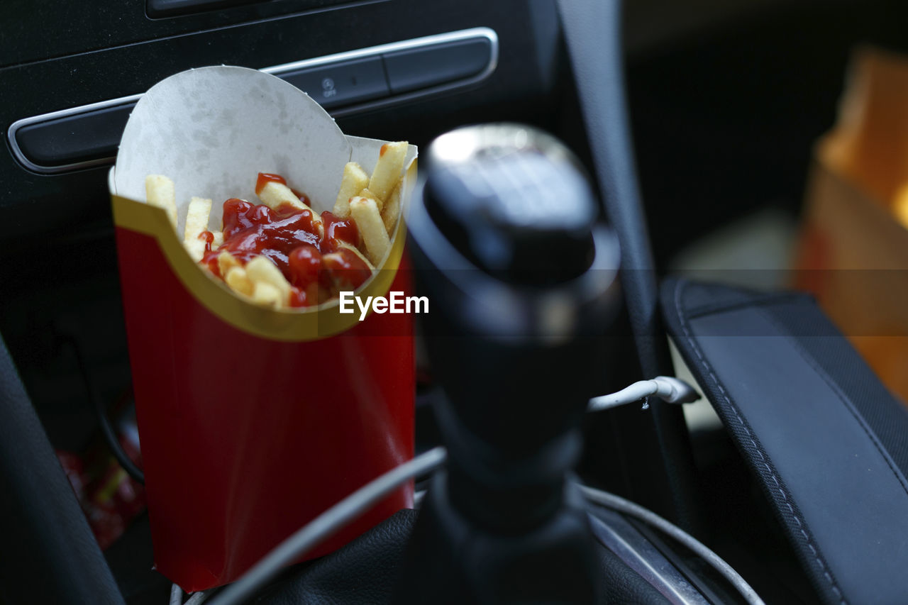 Packet of potato chips to eat in the car, processed food, car