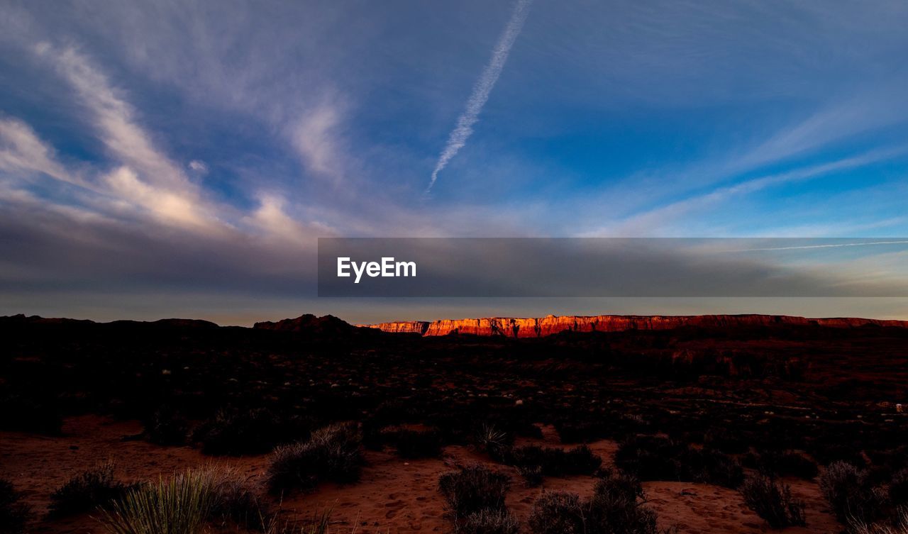 Scenic view of landscape against sky during sunset