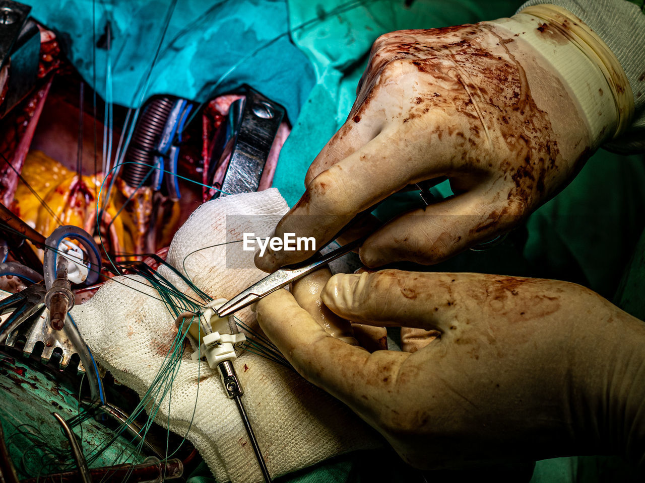 cropped hand of man working at construction site