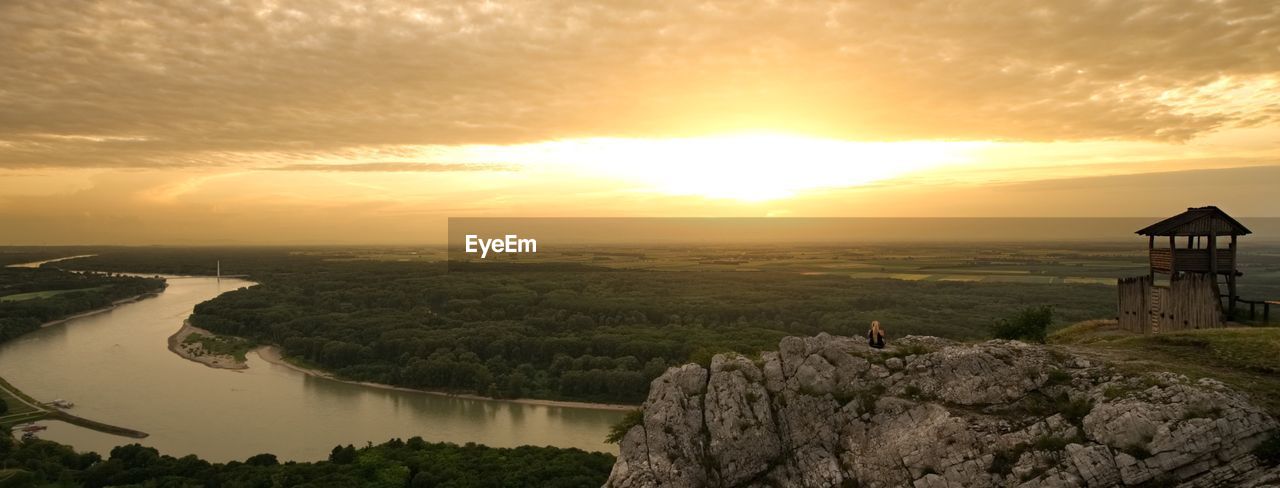 SCENIC VIEW OF BUILDING AGAINST SKY AT SUNSET