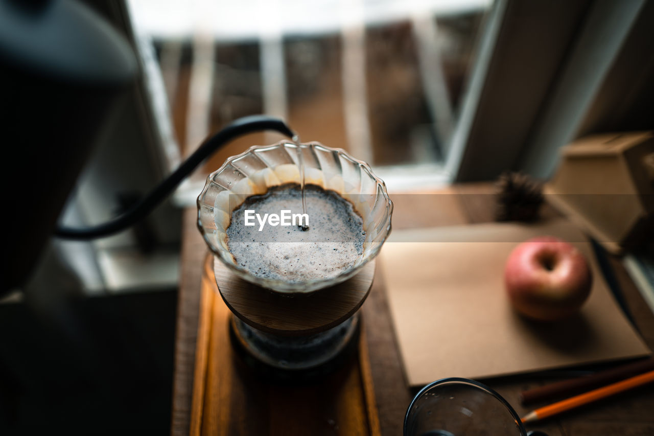 High angle view of drink in glass on table