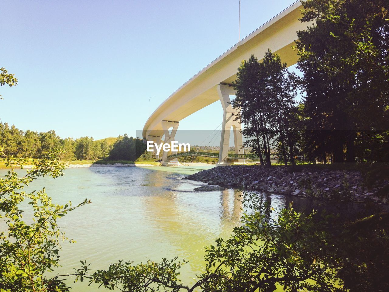 ARCH BRIDGE OVER RIVER AGAINST SKY