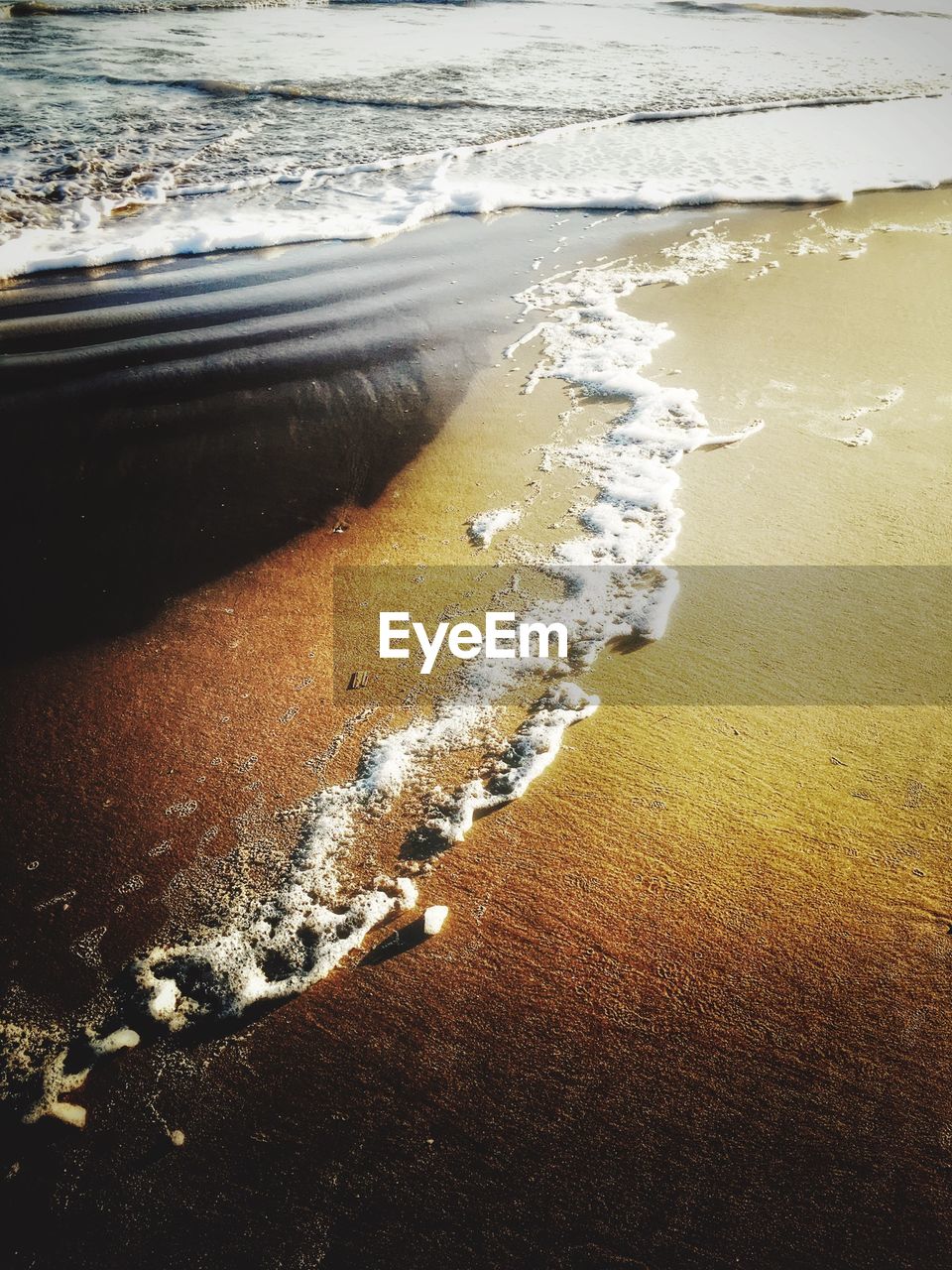 High angle view of surf at beach