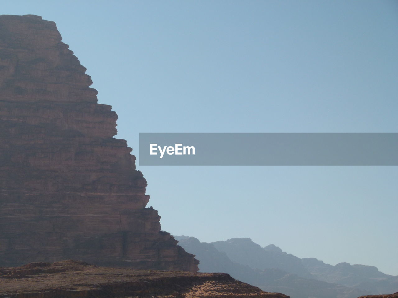 Low angle view of rock formation against clear sky in wadi rum