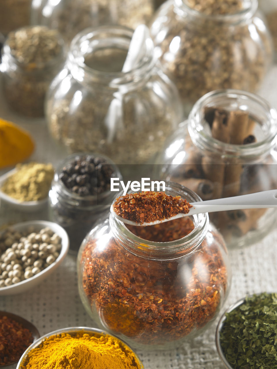 Close-up of various spices on burlap