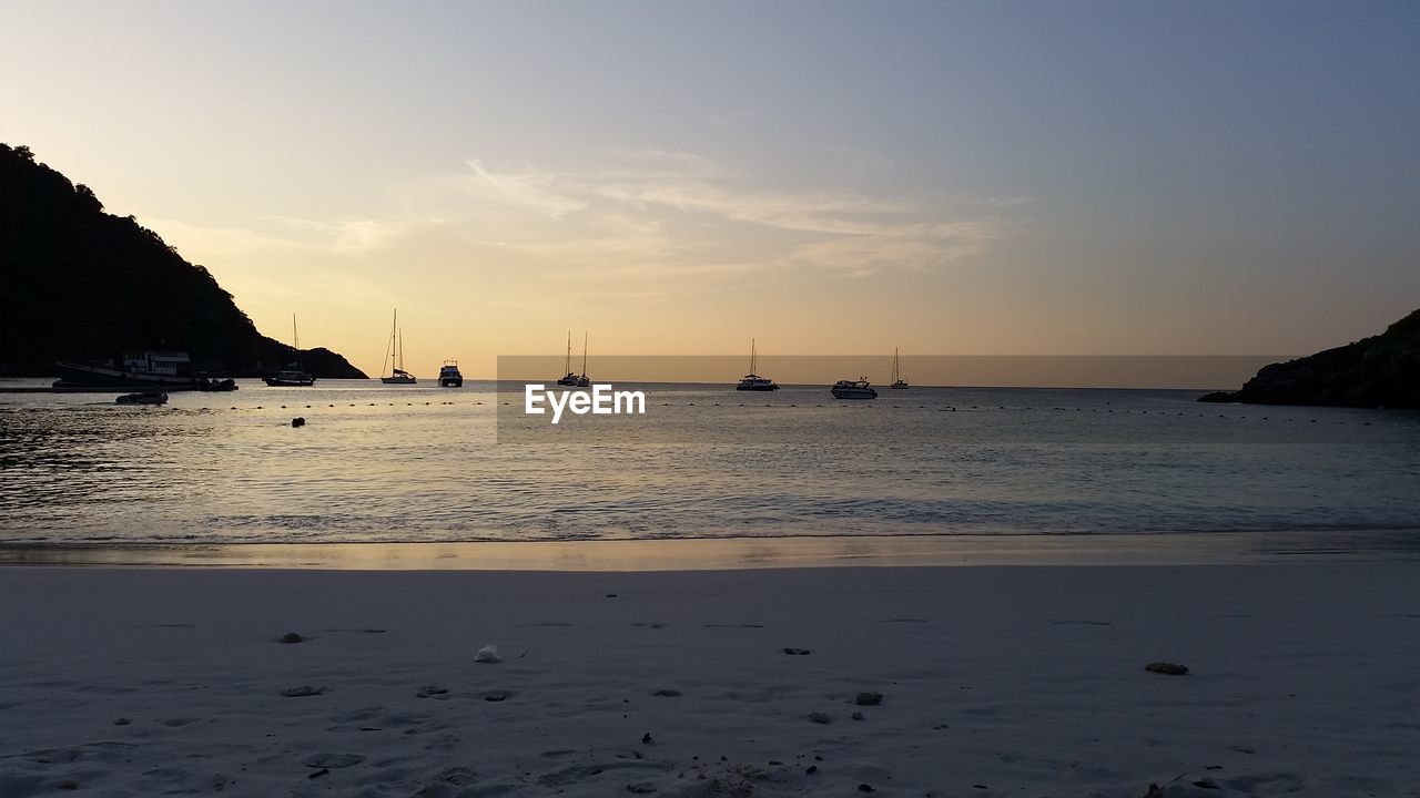 Scenic view of sea against sky at sunset