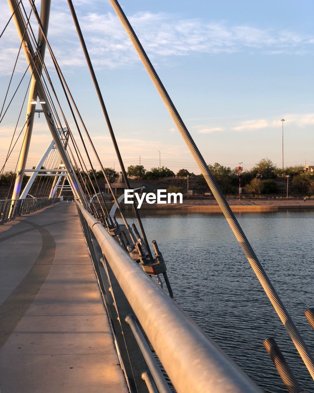 View of bridge over river against sky during sunset