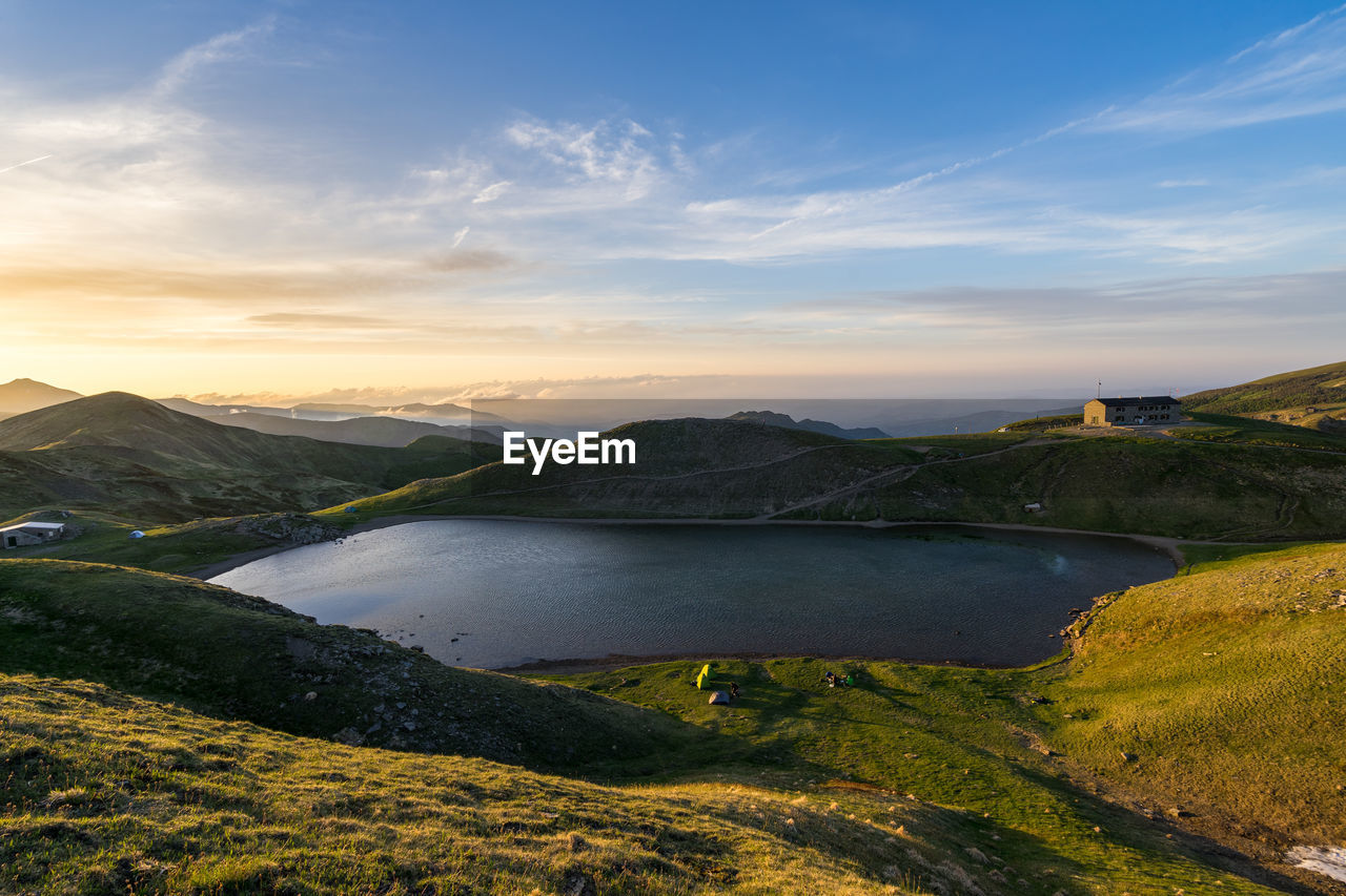 Scenic view of lake against sky during sunset