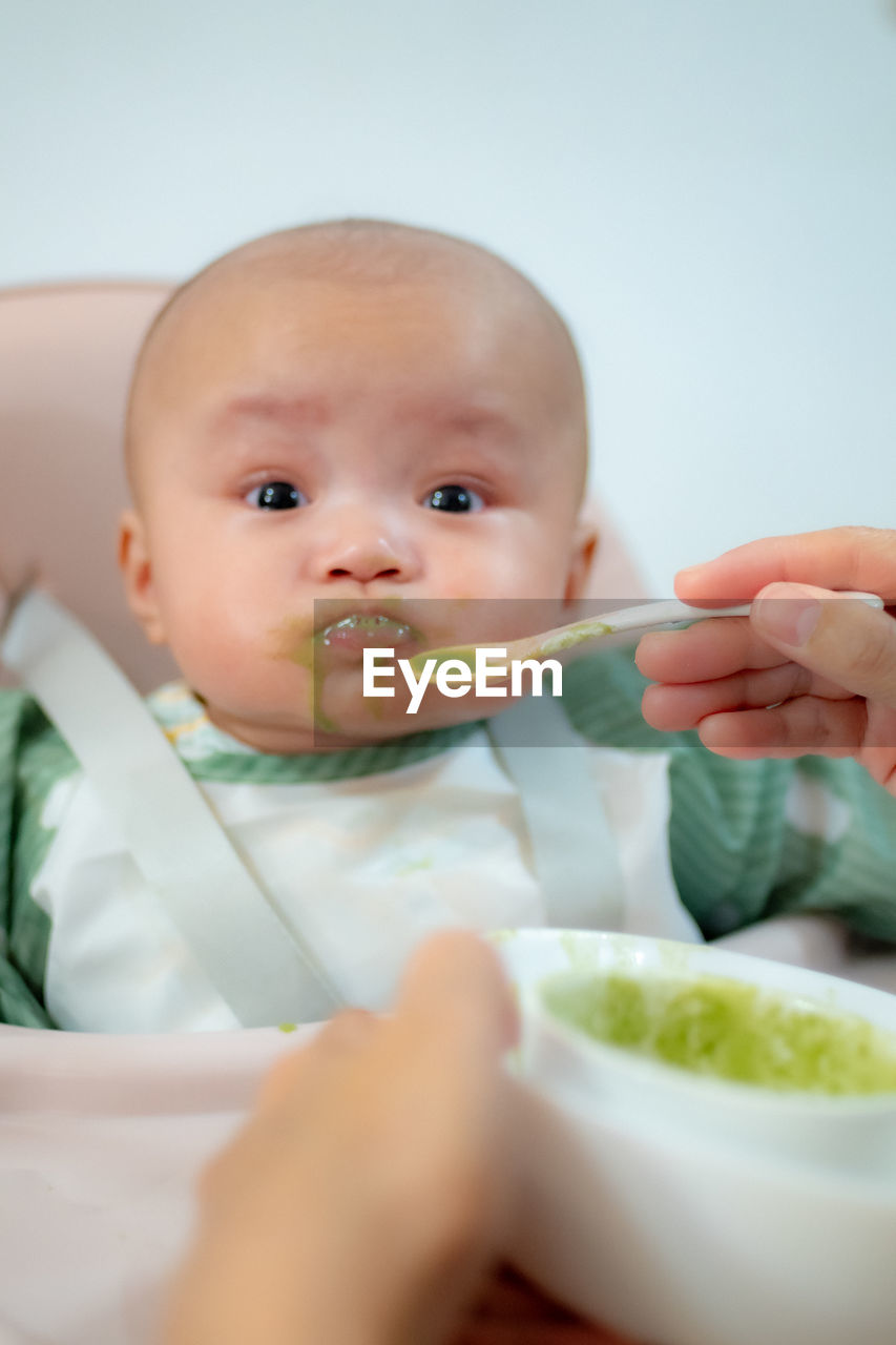 Portrait of cute boy eating food