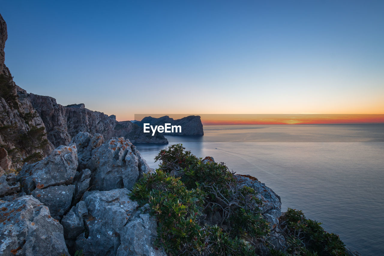 Scenic view of sea at cap de formentor on majorca mallorca during sunset against sky