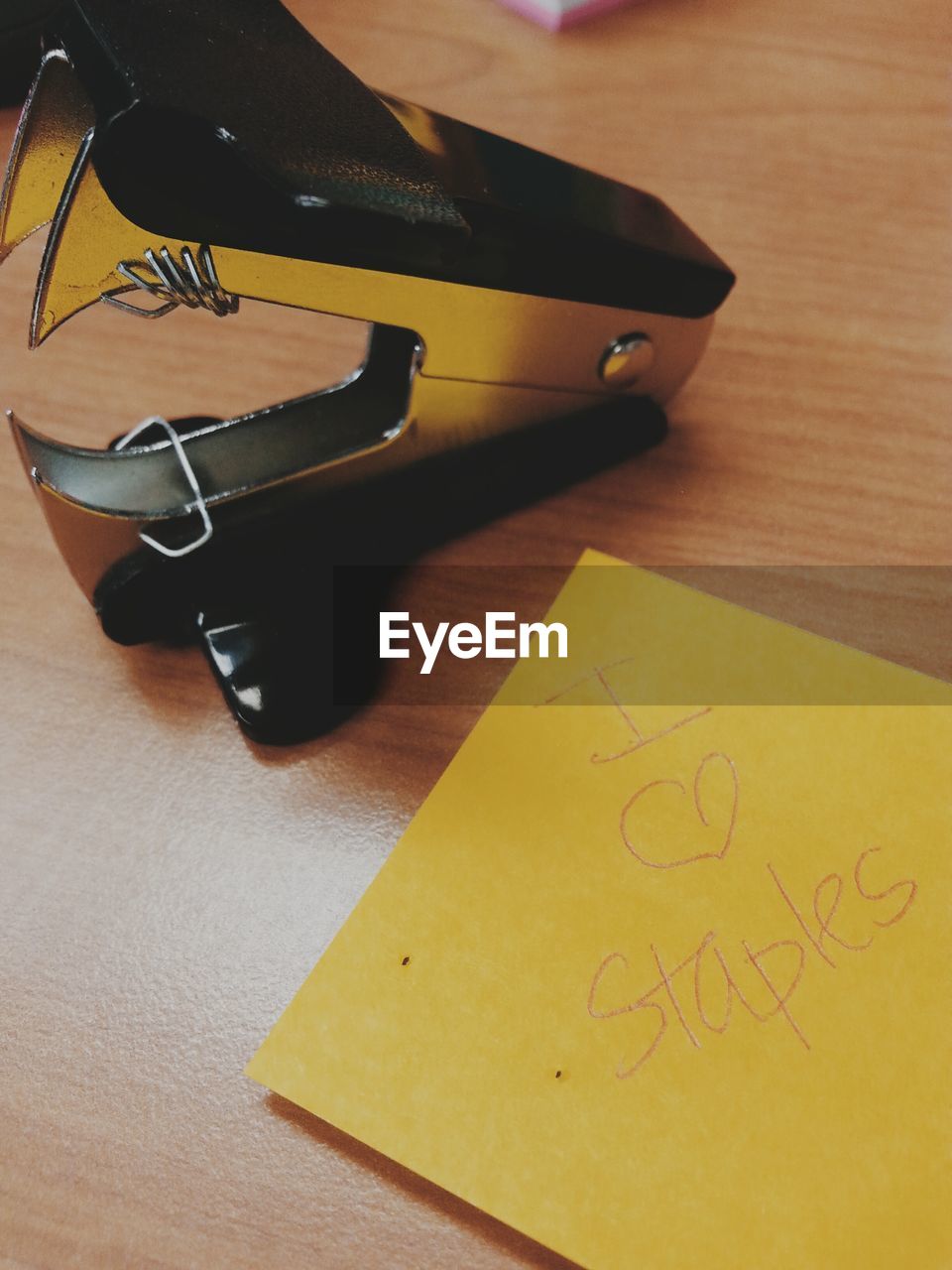 High angle view of stapler on table in office