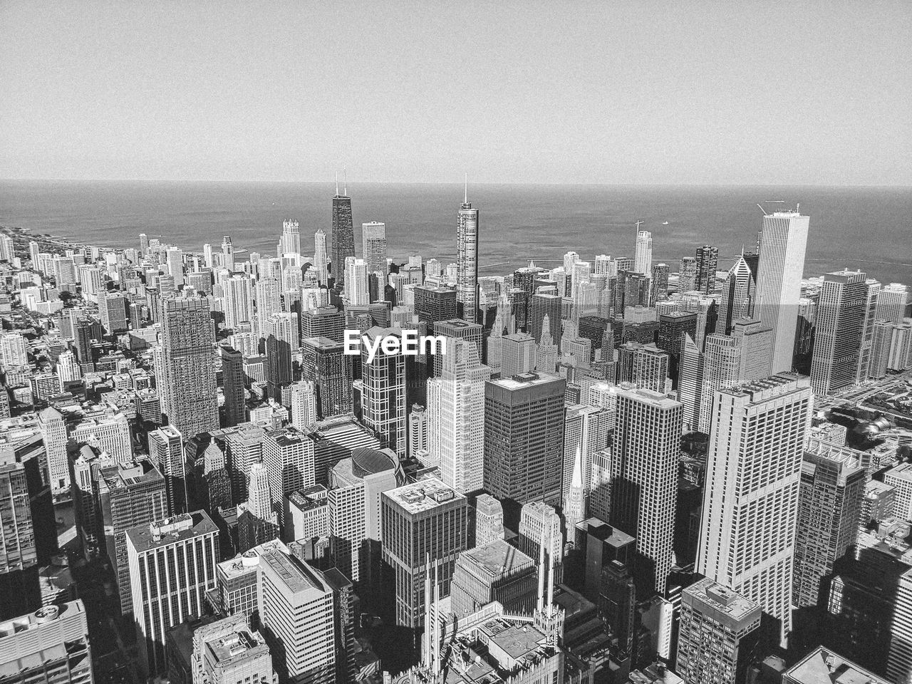 Aerial view of modern buildings in city against sky