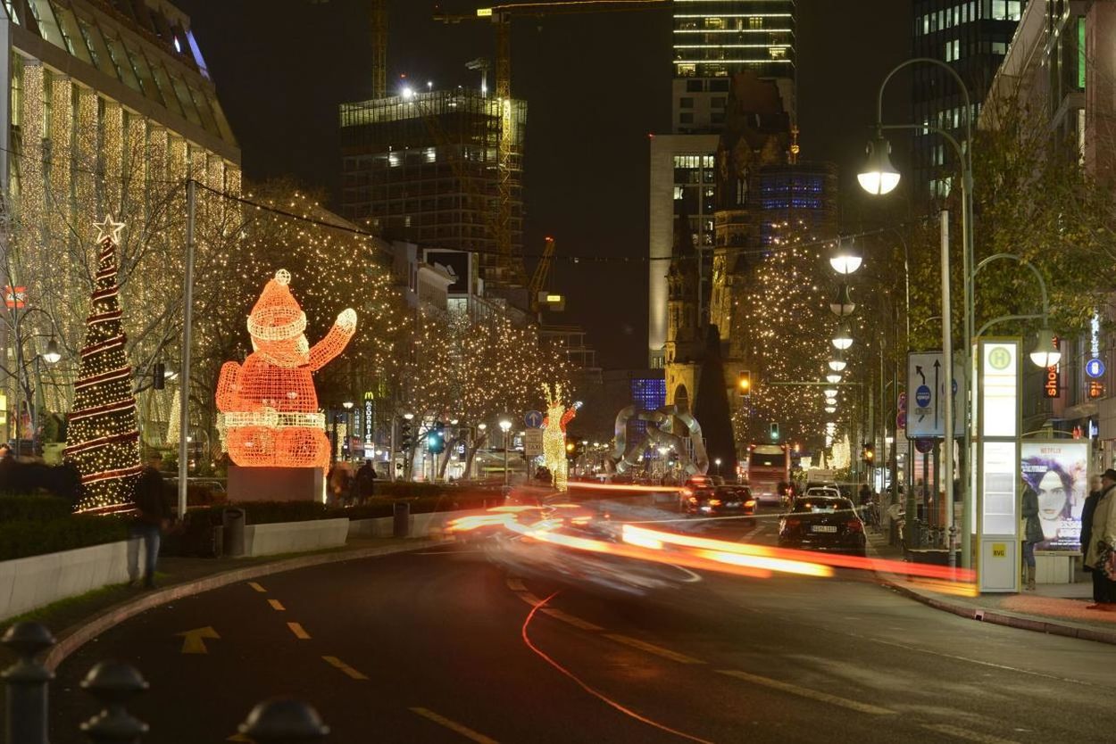 Cars on illuminated city street during christmas