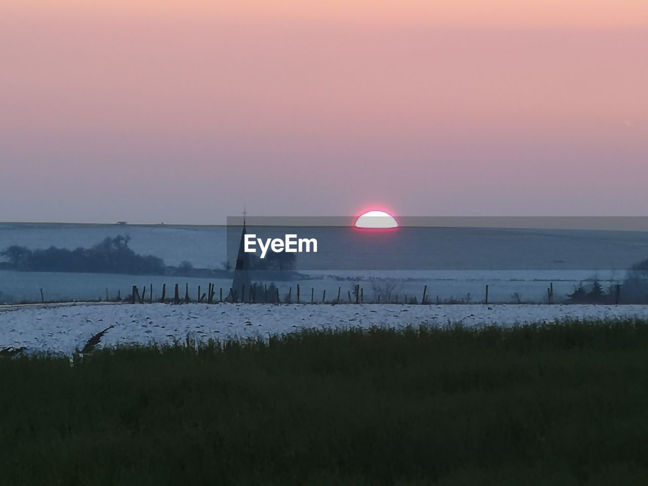 SCENIC VIEW OF LAND DURING SUNSET