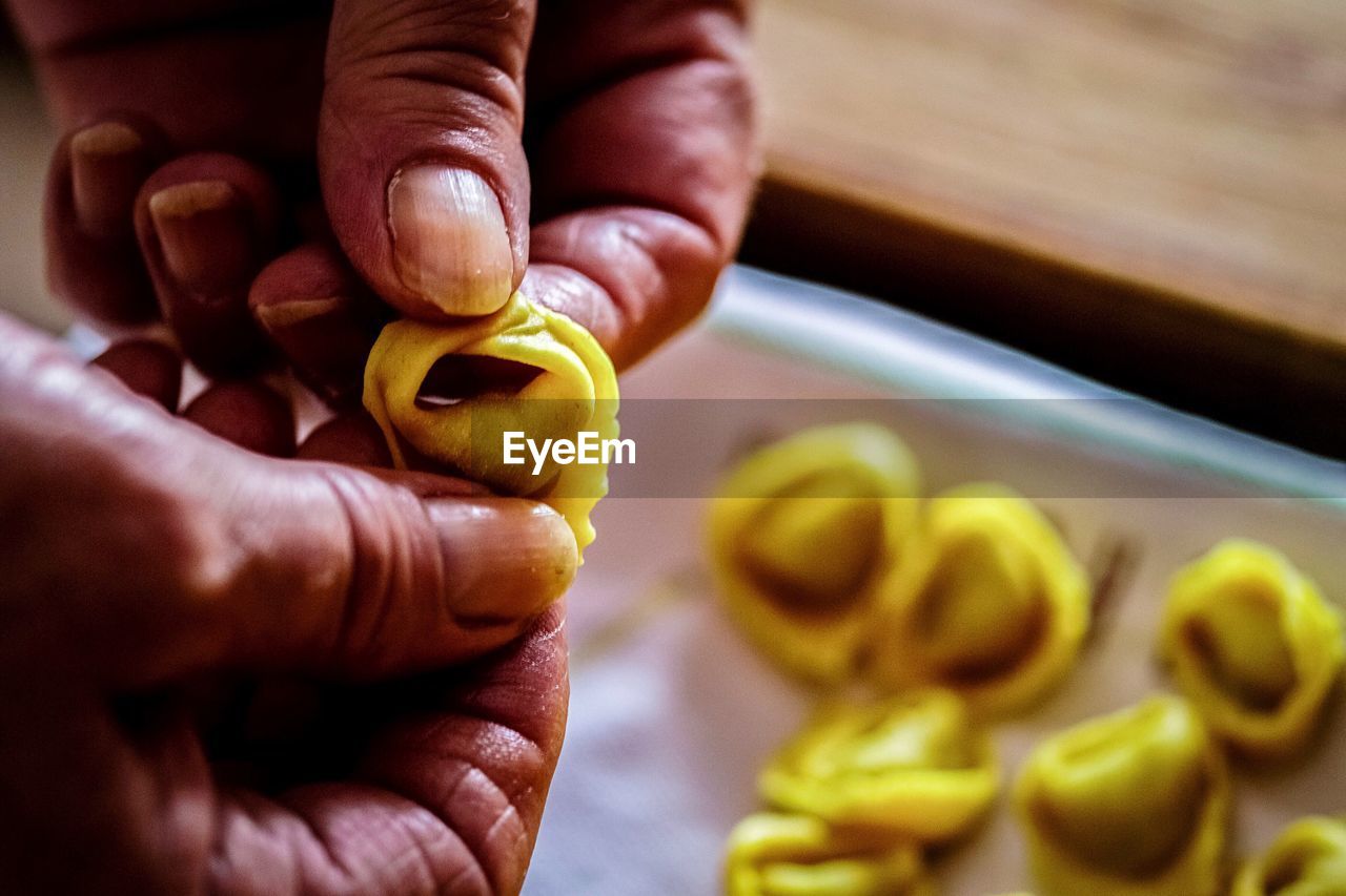 Cropped hands preparing food