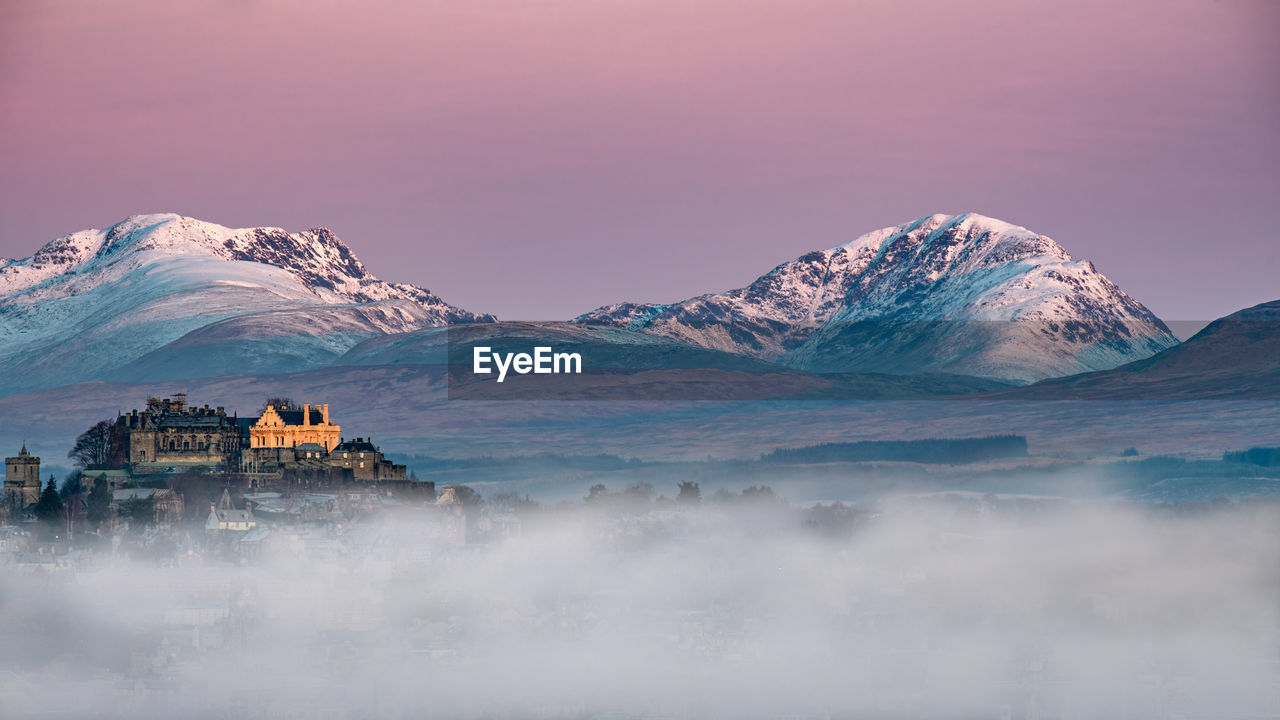 Winter morning sunrise and mists at stirling castle in the scottish highlands