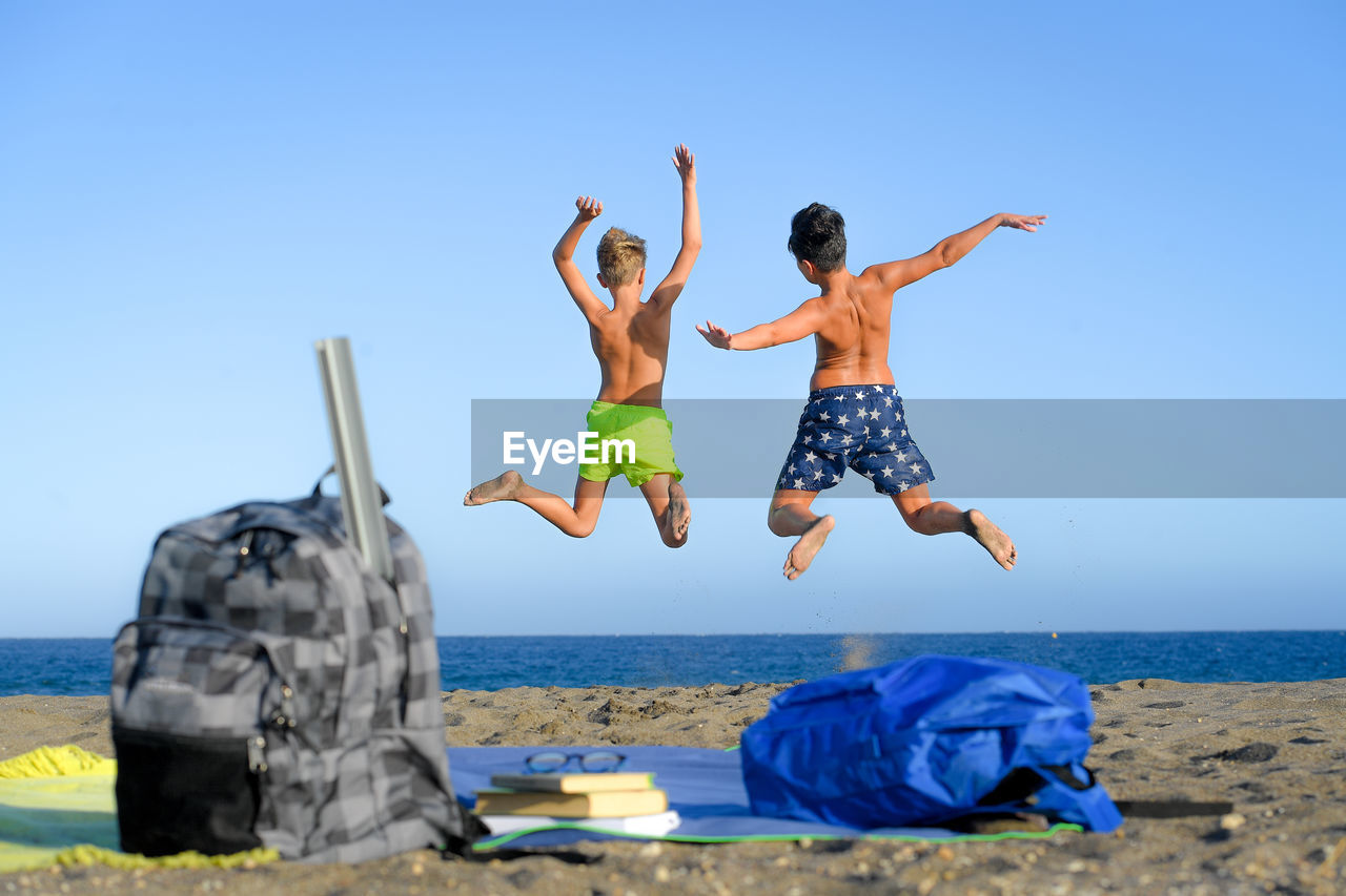 Brothers enjoying at beach