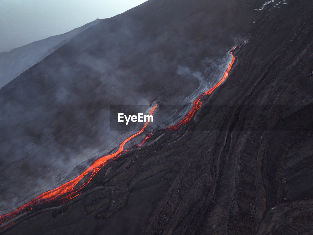 Lava flow on etna volcano aerial view from above - sicily from above
