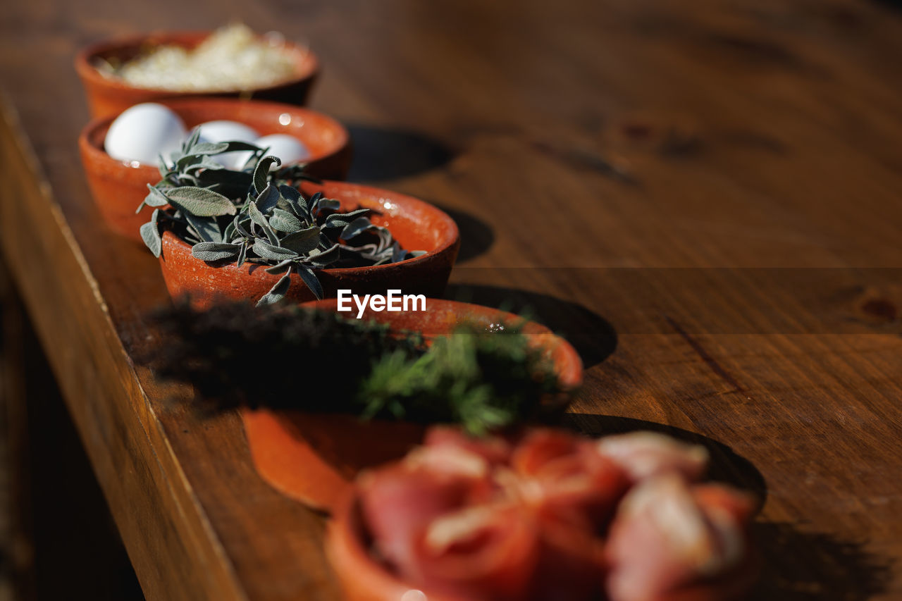 food and drink, food, wood, healthy eating, freshness, wellbeing, no people, indoors, vegetable, produce, table, meal, herb, selective focus, seafood, red, macro photography, close-up, still life, fruit, high angle view
