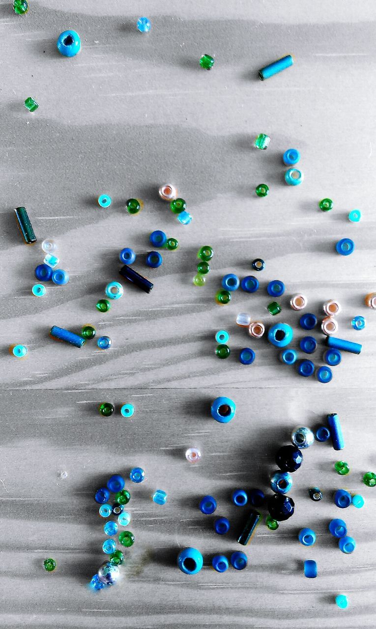 Multi colored beads scattered on floor