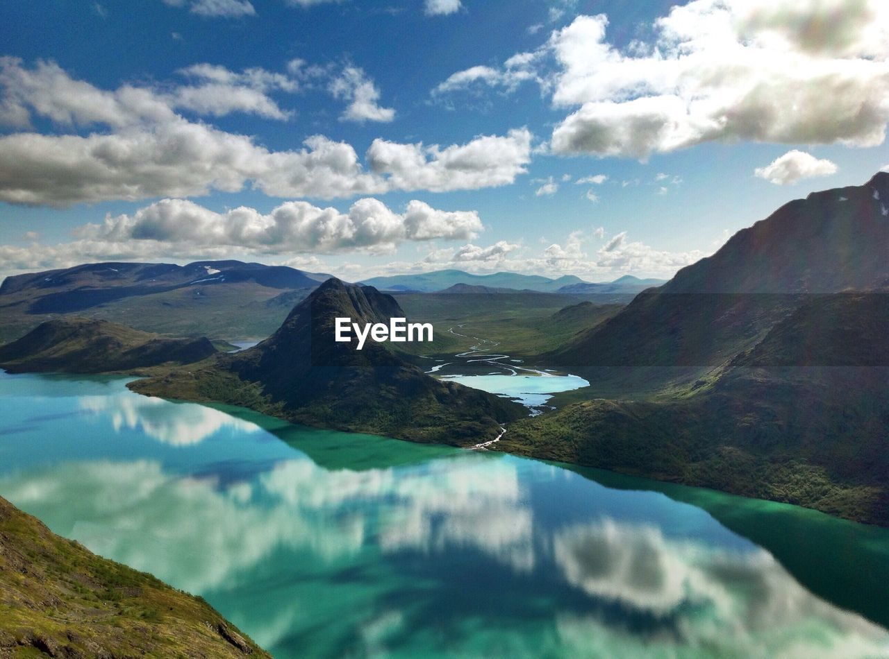 Scenic reflection of clouds in calm lake