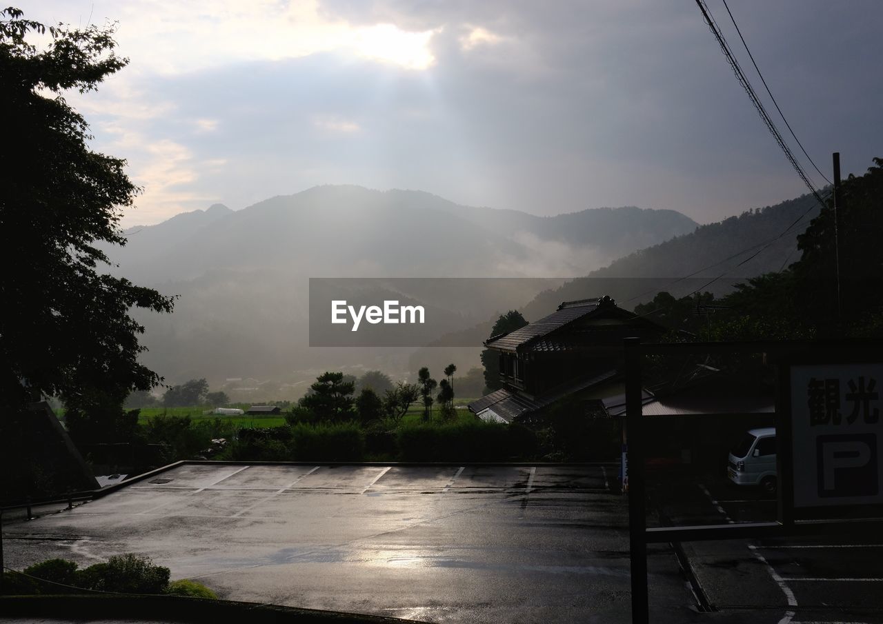 SCENIC VIEW OF CLOUDY SKY OVER MOUNTAINS