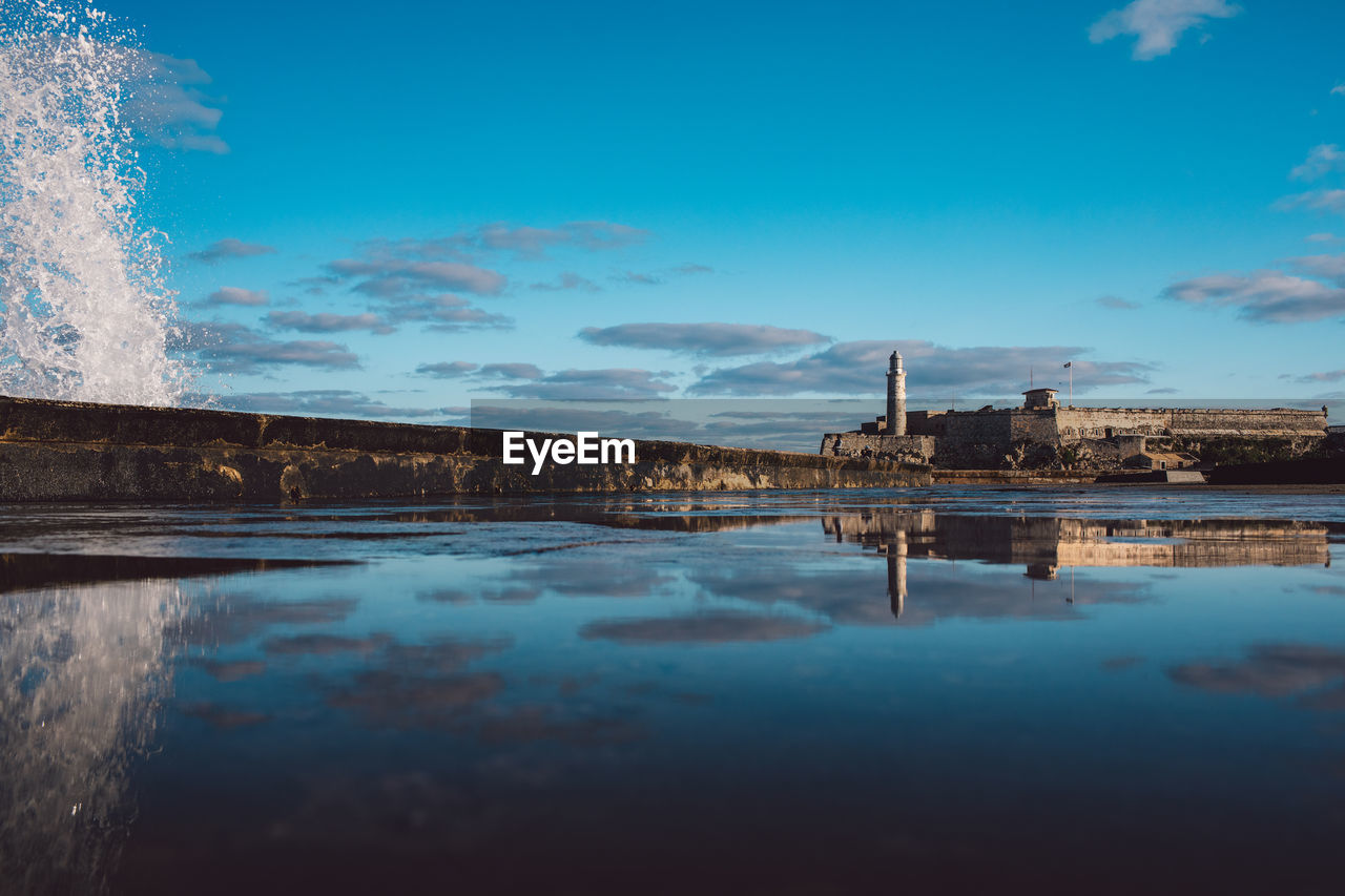 Scenic view of lake against blue sky