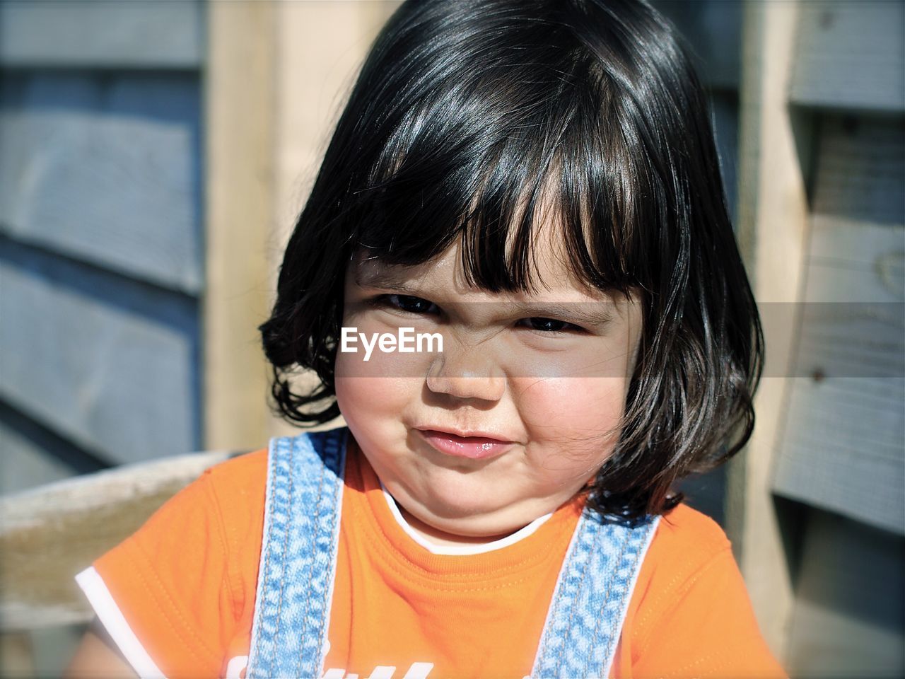 Close-up portrait of girl making a face