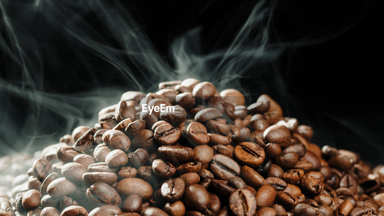 food and drink, food, close-up, coffee, roasted coffee bean, brown, freshness, drink, smoke, large group of objects, scented, no people, black background, nature, still life, steam, roasted, dark, abundance, indoors, produce, heap, copy space
