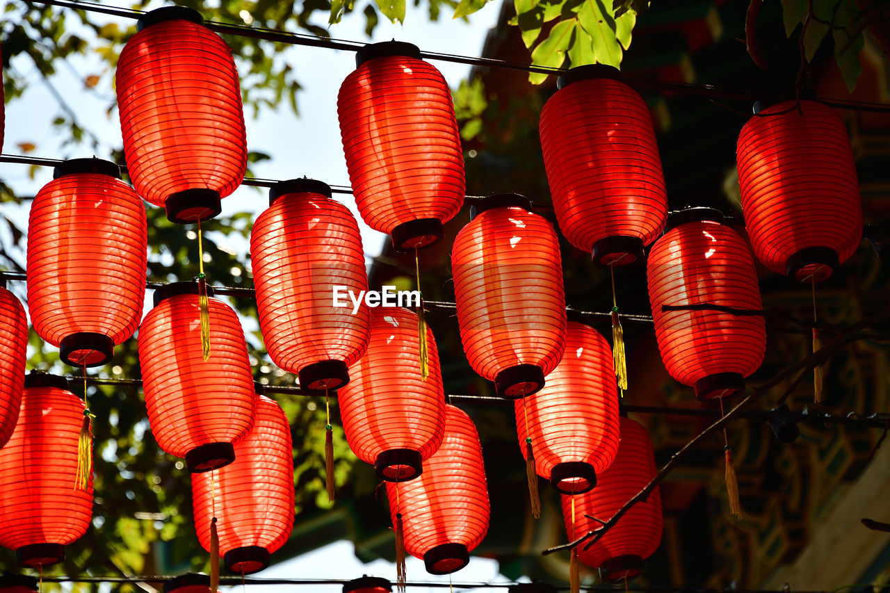 Low angle view of red lanterns hanging in the temple